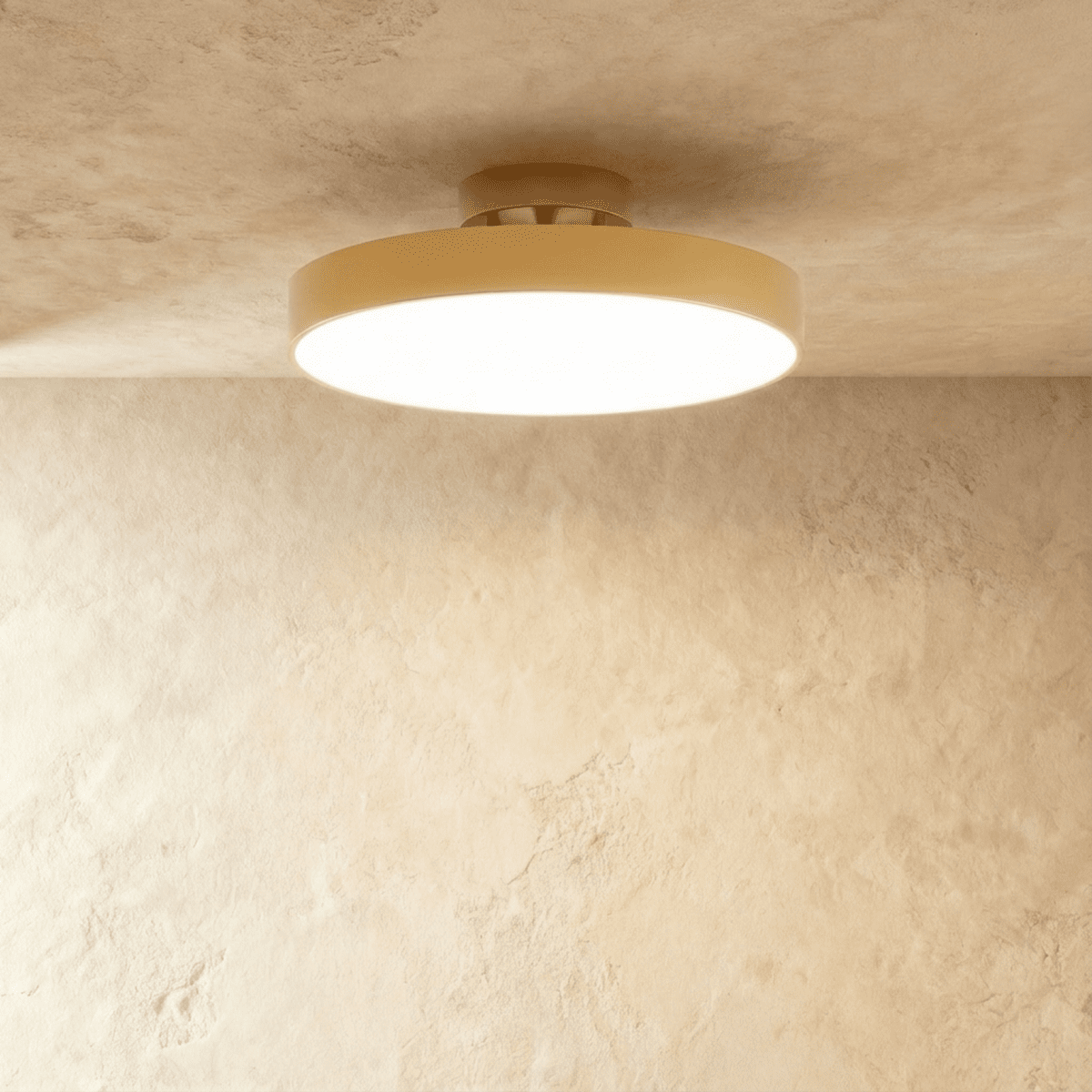 Clérachic copper-finish flush-mount light with a wide frosted diffuser, centred on a plain plaster ceiling corner.