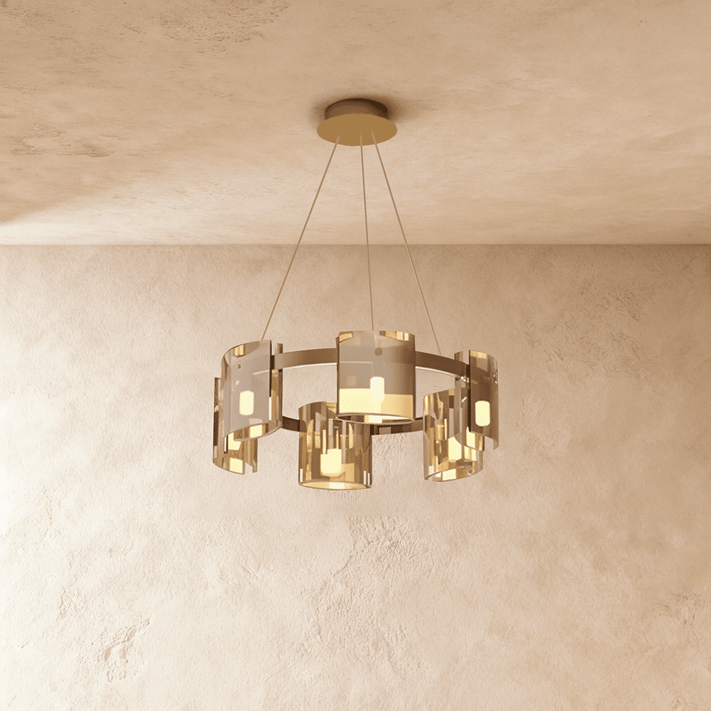 Clérachic chandelier in a single tier of amber-toned glass cylinders on slim suspension cables.