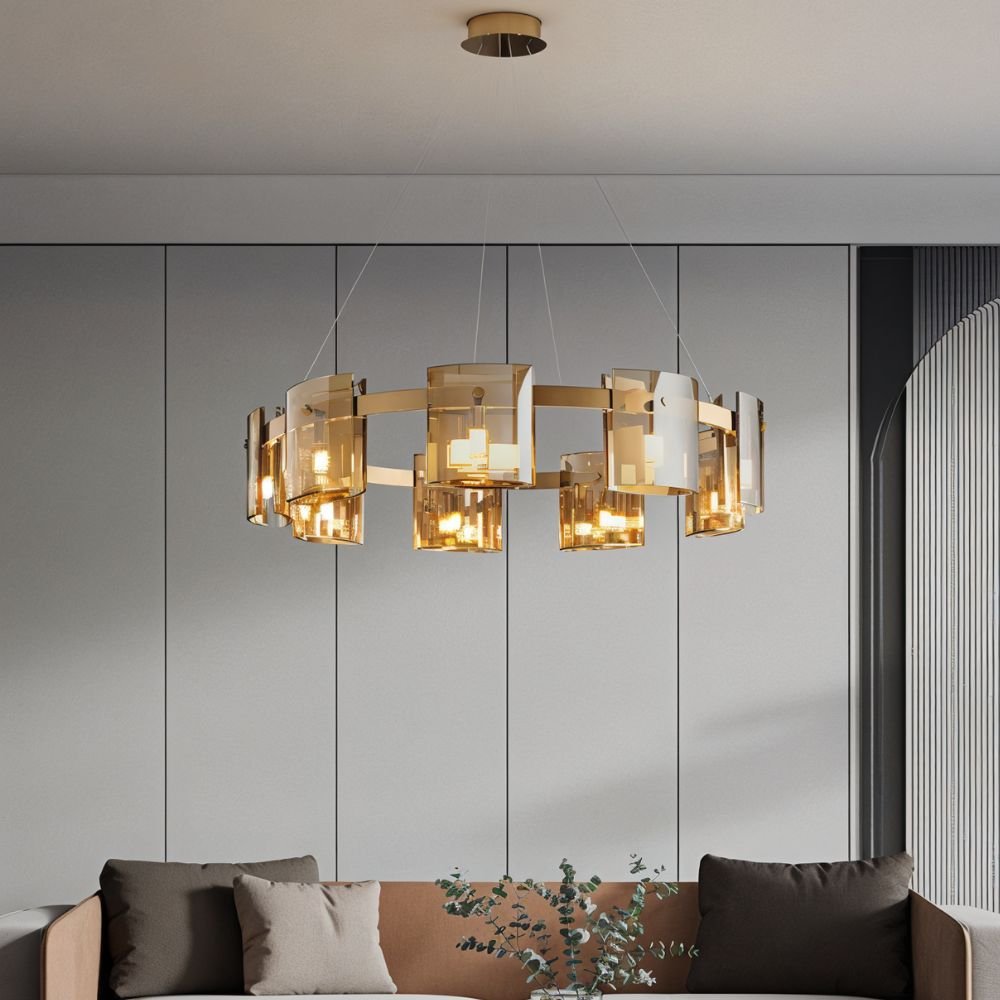 A Clérachic chandelier in amber-toned glass hangs above a sofa in a panelled grey living room.