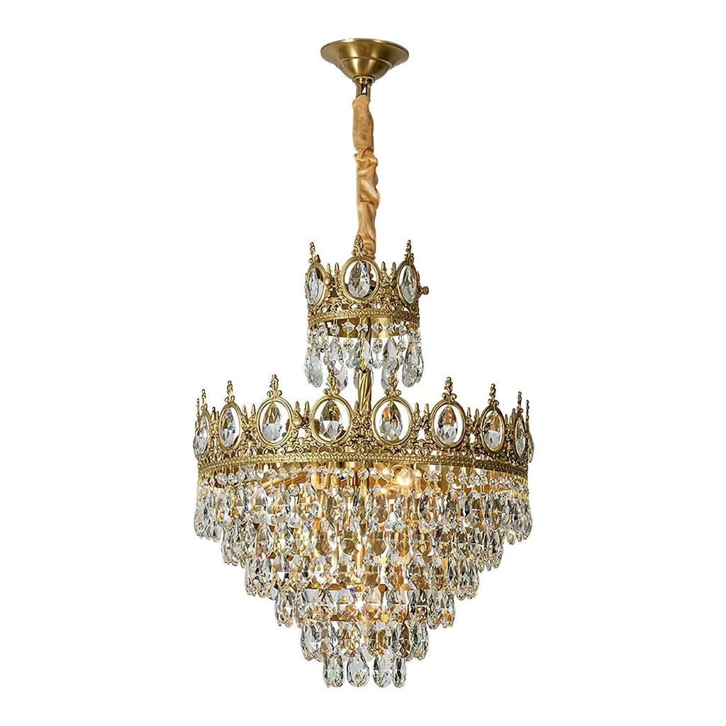 This Clérachic chandelier on a white background, with a brass canopy, a gold-wrapped chain and clear crystal tiers.