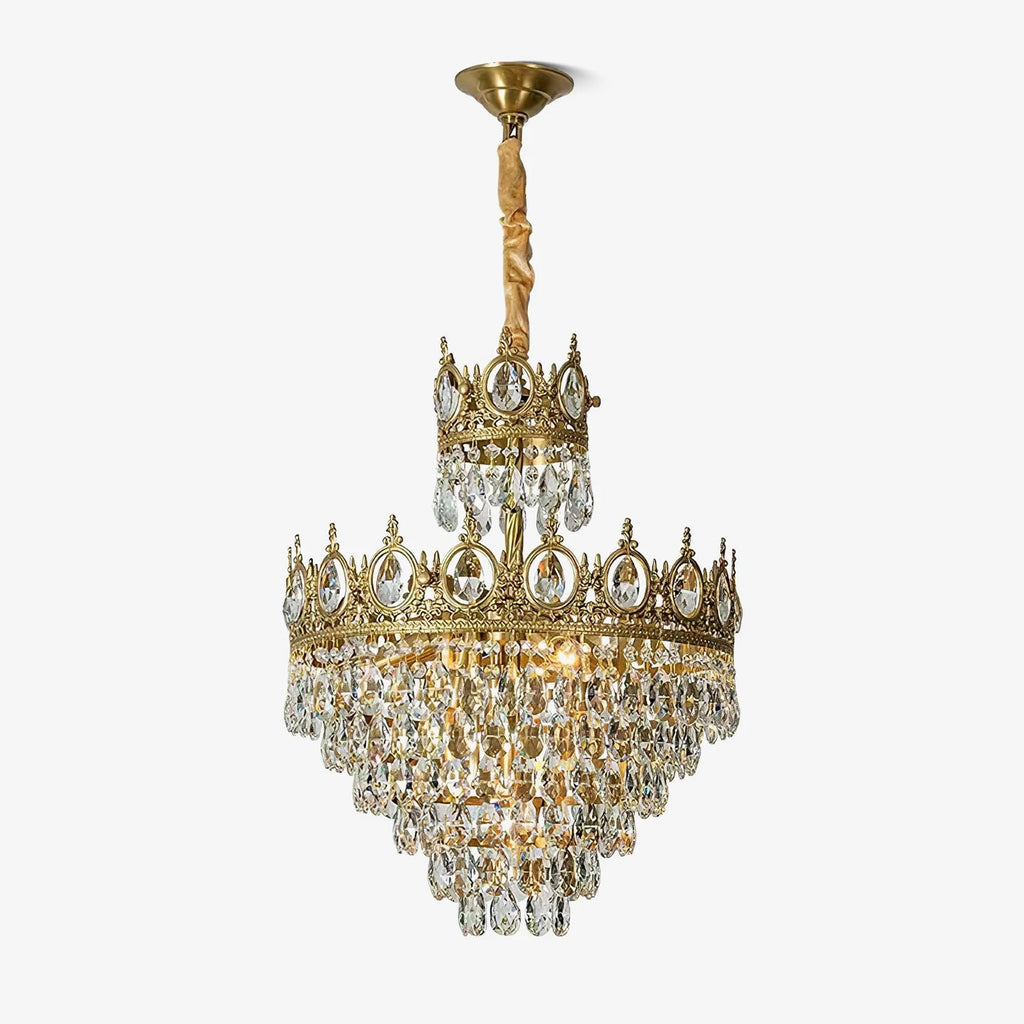 Clérachic crystal chandelier on a white background, with a brass ceiling canopy and a short gold-wrapped chain.
