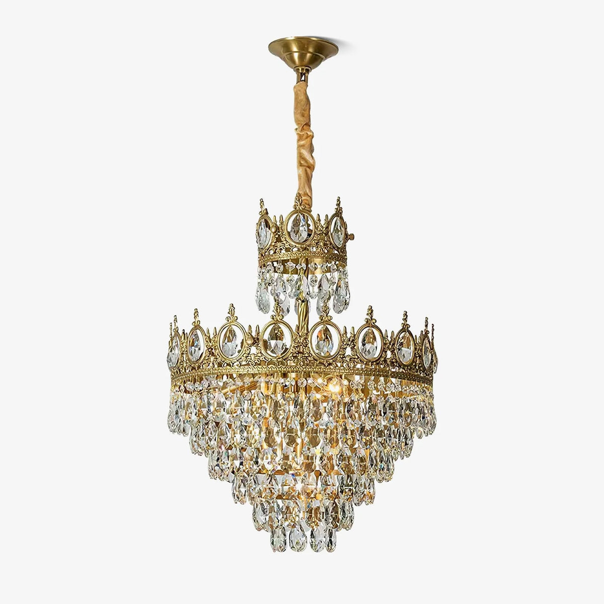 Clérachic crystal chandelier on a white background, with a brass ceiling canopy and a short gold-wrapped chain.