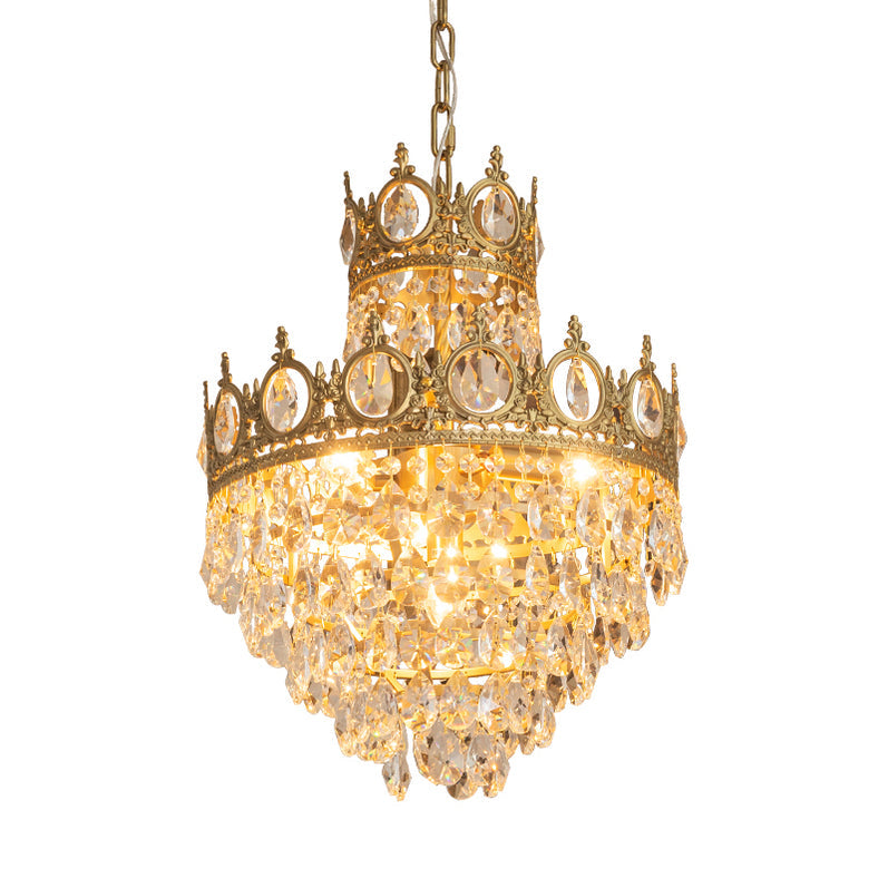Clérachic crystal chandelier lit on a white background, with crown tiers glowing above layered clear teardrops.