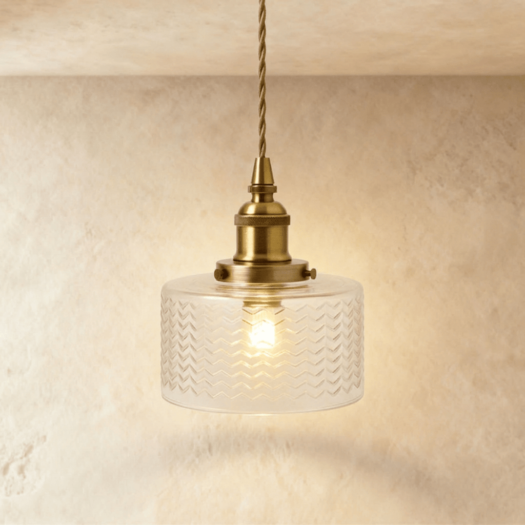 Clérachic Isabel pendant light, a compact clear glass drum shade with a fine chevron pattern on a brass fitting.