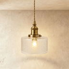 Clérachic Isabel pendant light, a compact clear glass drum shade with a fine chevron pattern on a brass fitting.
