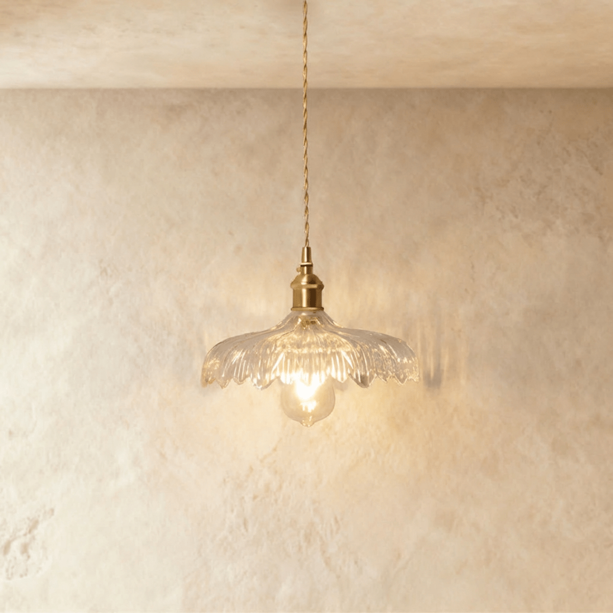 Clérachic Isabel pendant light, a wide flat clear glass saucer shade with sunburst ribbing and a diamond-textured rim.