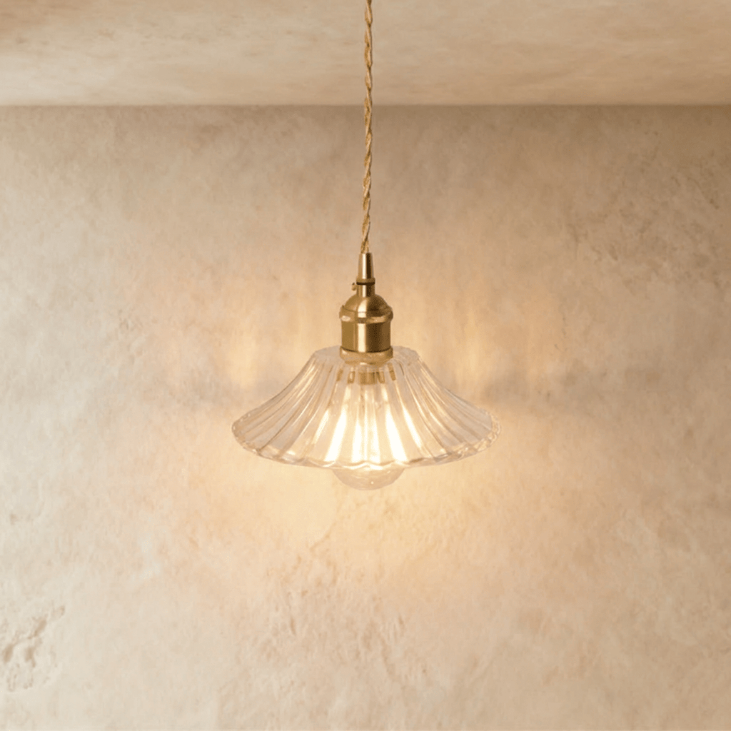 Clérachic Isabel pendant light, a wide fluted clear glass saucer shade with fine ribbing and an exposed bulb below.