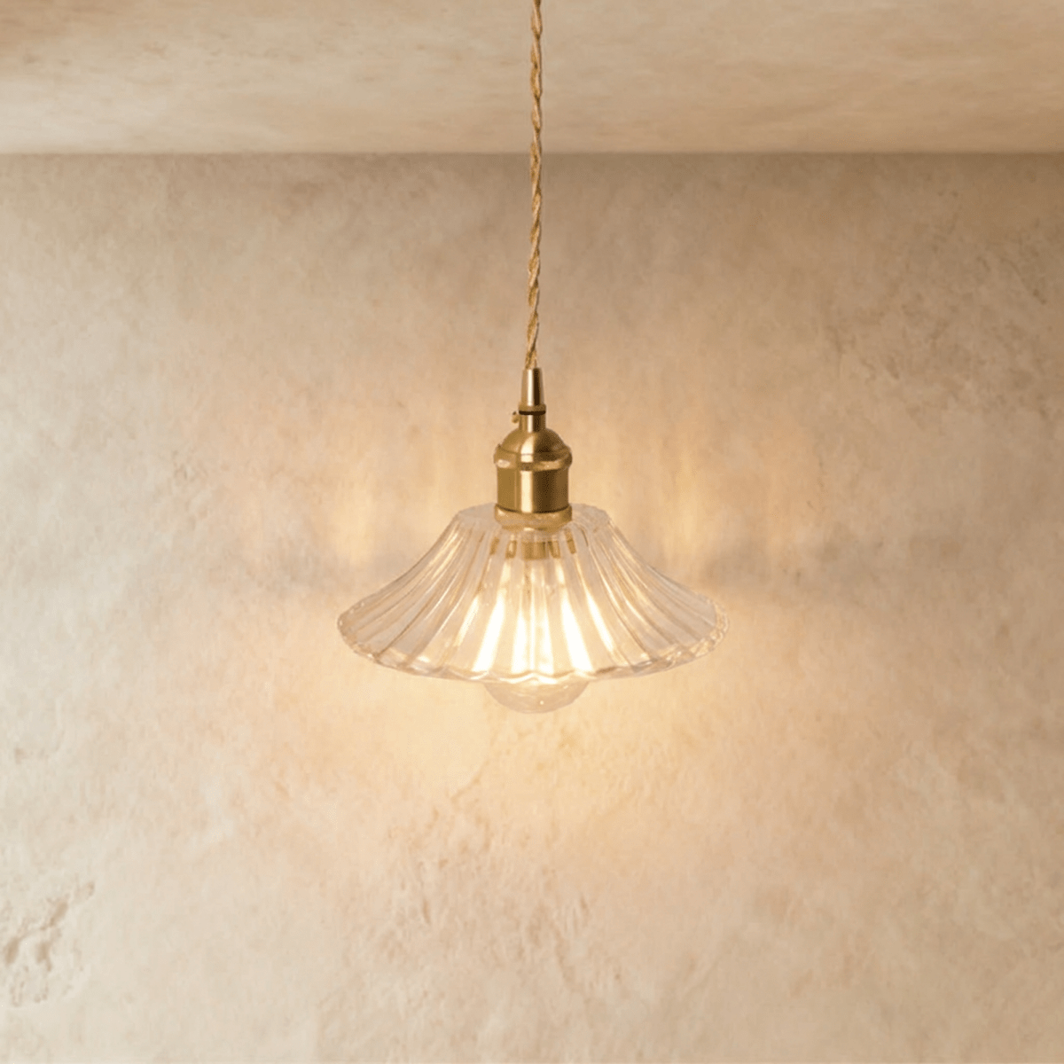 Clérachic Isabel pendant light, a wide fluted clear glass saucer shade with fine ribbing and an exposed bulb below.