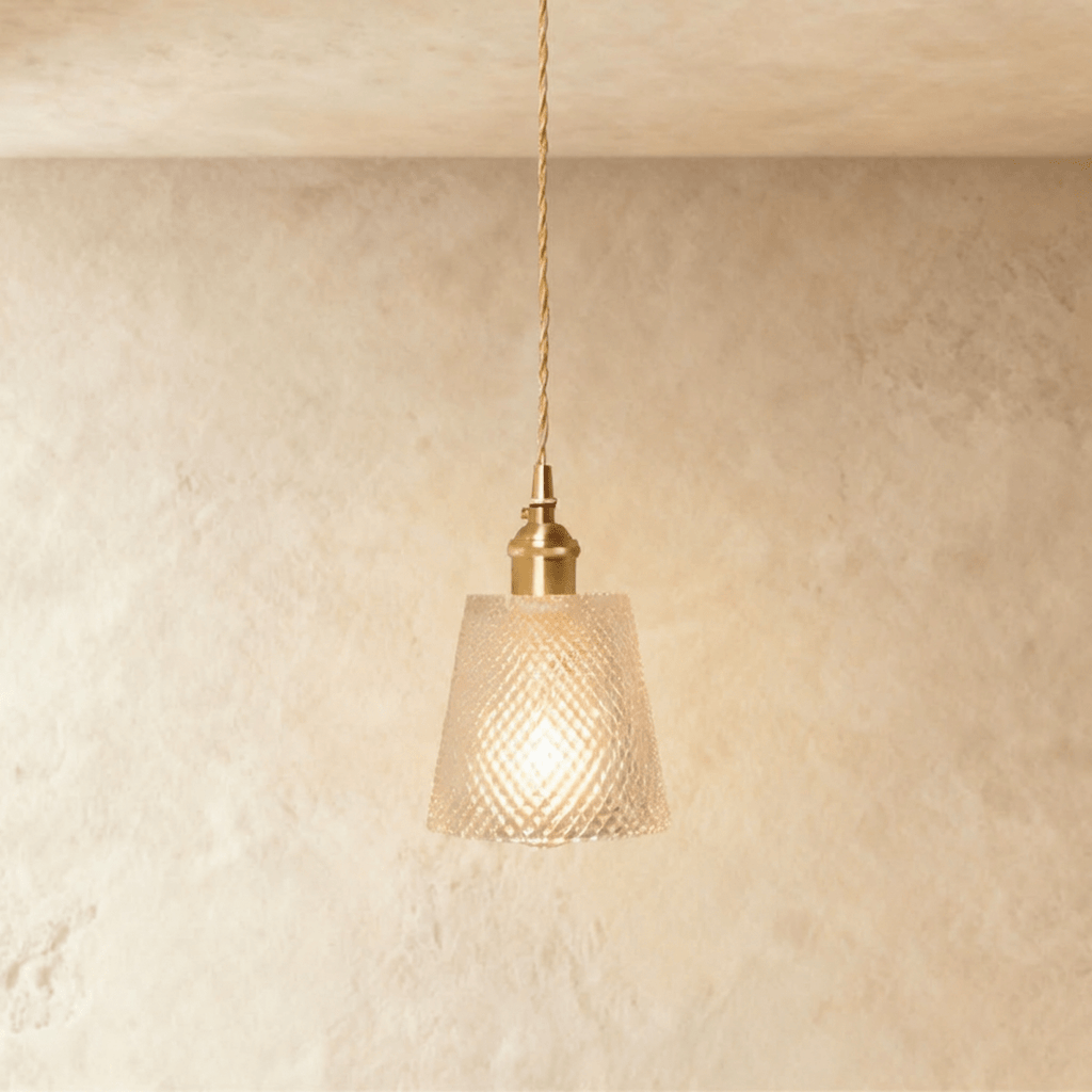 Clérachic Isabel pendant light, a compact clear glass drum shade with a fine diamond-cut texture on brass fitting.