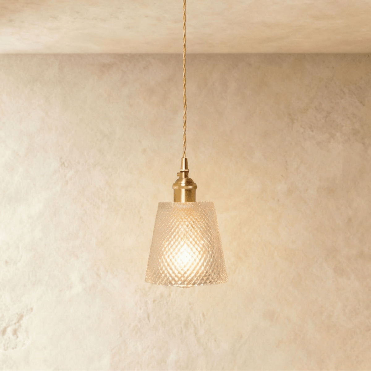 Clérachic Isabel pendant light, a compact clear glass drum shade with a fine diamond-cut texture on brass fitting.