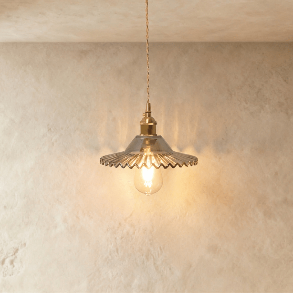 Clérachic Isabel pendant light, a ribbed smoke-grey glass saucer shade with a scalloped edge and exposed bulb.