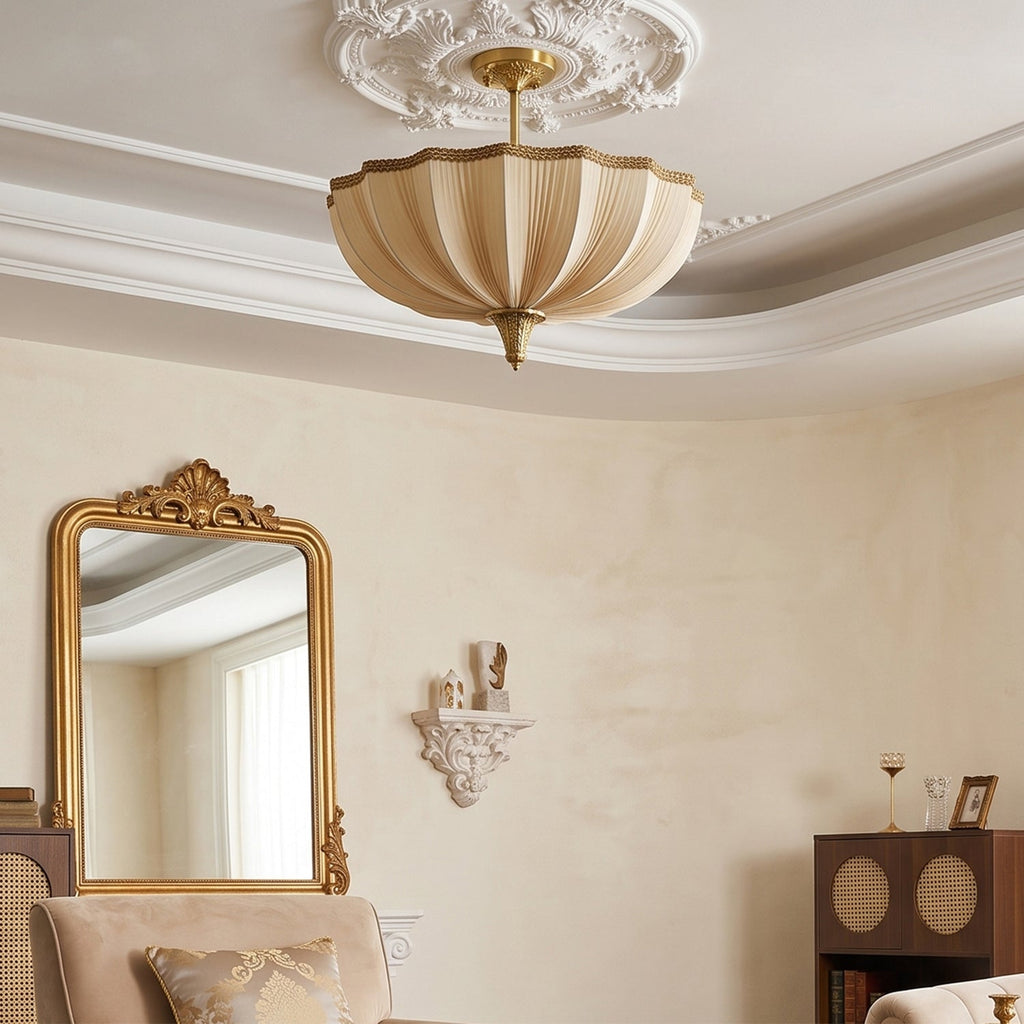 Clérachic ceiling light below a decorative white ceiling rose, with a tall gilt mirror and a small cabinet in a cream room.