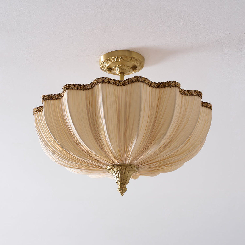 Clérachic semi-flush light, unlit, on a pale ceiling, the pleated cream fabric folded in soft vertical ribs.