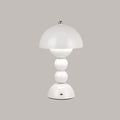 White Clérachic dome lamp on a grey backdrop, with a small charging port visible at the base.