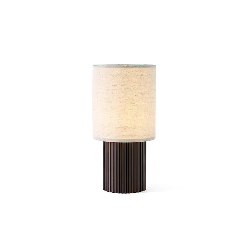 This Clérachic cordless lamp on a white backdrop, shown smaller and unlit-looking, a linen shade over its ribbed base.
