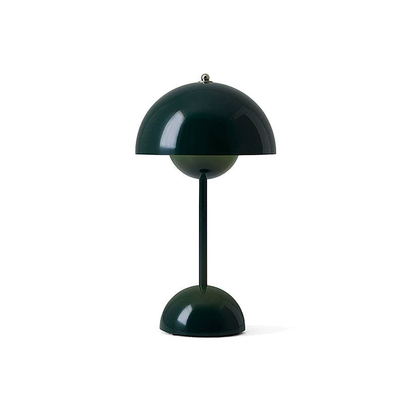 A dark-green Clérachic table lamp with a glossy dome shade and a slim stem, on a plain white backdrop.