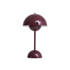 A deep plum Clérachic table lamp with a glossy dome shade and a slim stem, on a plain white backdrop.
