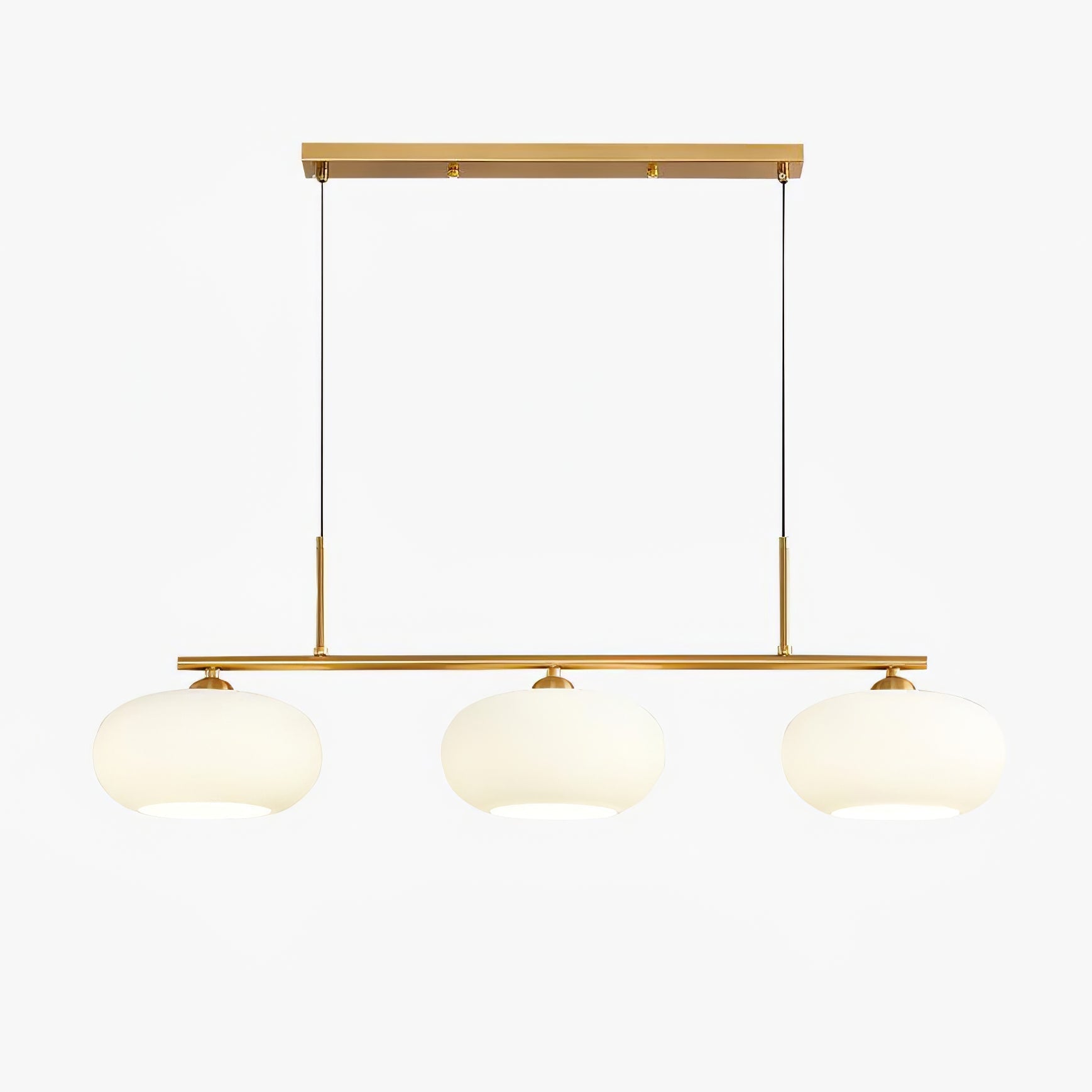 Clérachic cream glass 3-light cluster, gold canopy and bar, three lit pebble shades on a clean white backdrop.