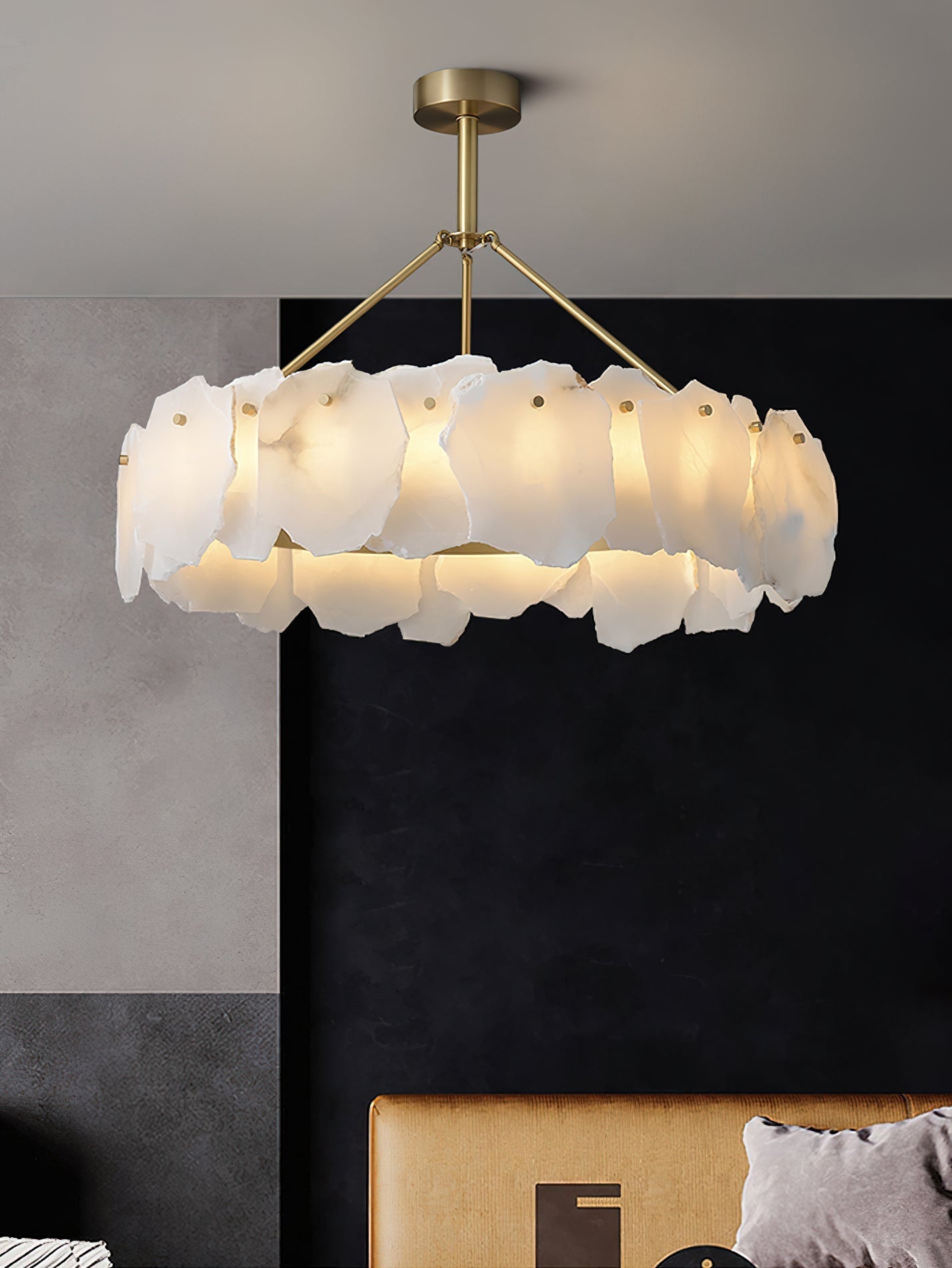 Clérachic Cryon photographed close against a black panel, each alabaster plate pinned by its own brass stud.