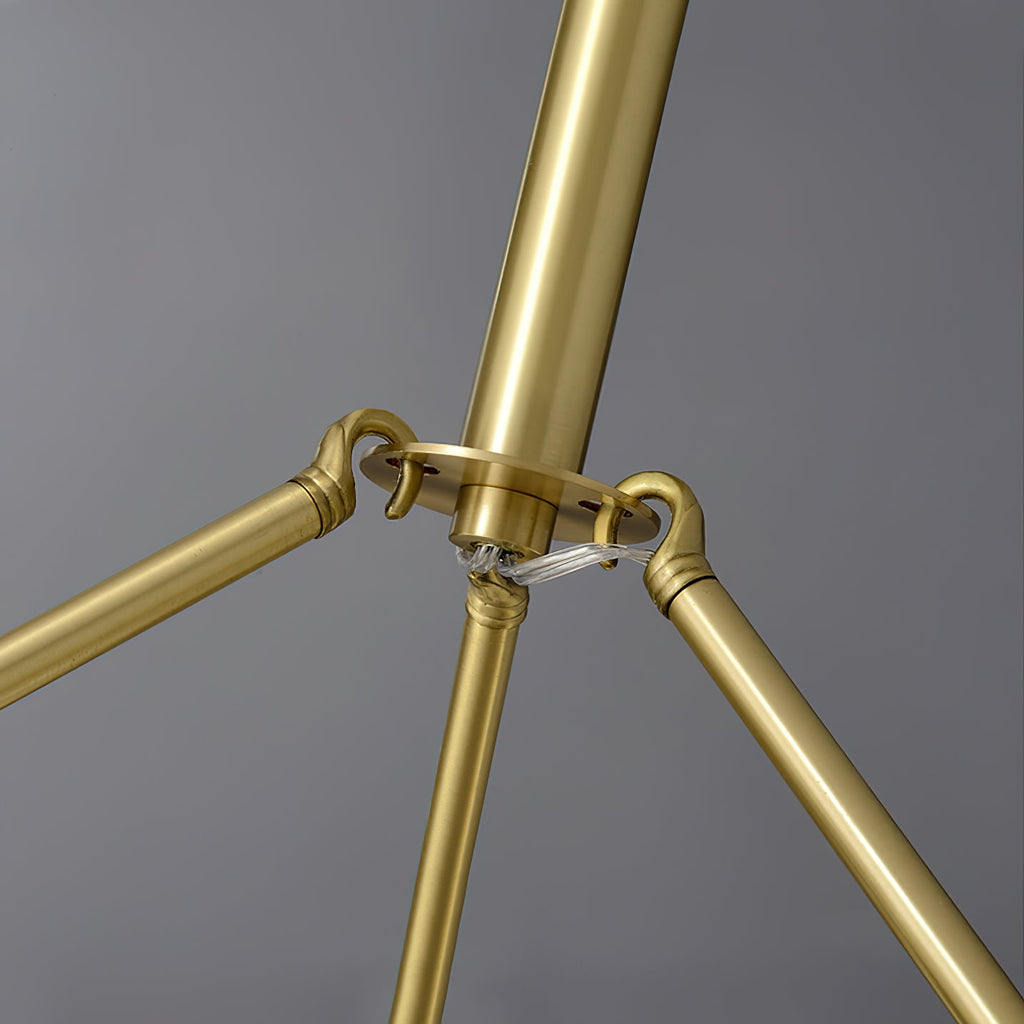 Clérachic Cryon close on the polished brass suspension arms where they meet at the central hub.