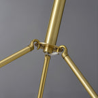 Clérachic Cryon close on the polished brass suspension arms where they meet at the central hub.