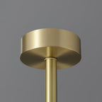The Clérachic Cryon brass ceiling canopy, a plain machined disc feeding the single central drop rod.