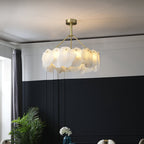 The Clérachic Cryon seen from below in a room with deep navy wainscoting, its alabaster ring lit warm.