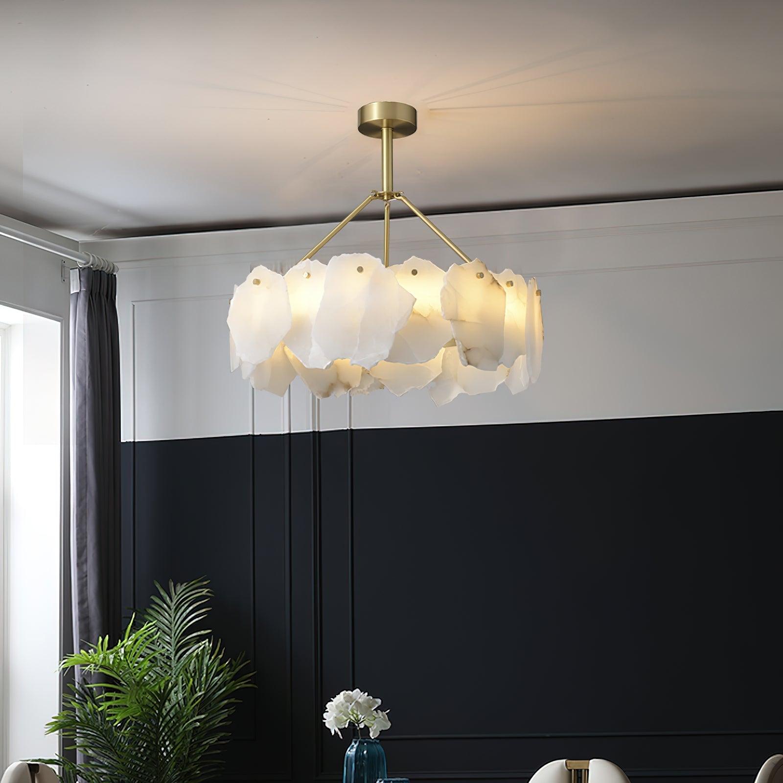 The Clérachic Cryon seen from below in a room with deep navy wainscoting, its alabaster ring lit warm.