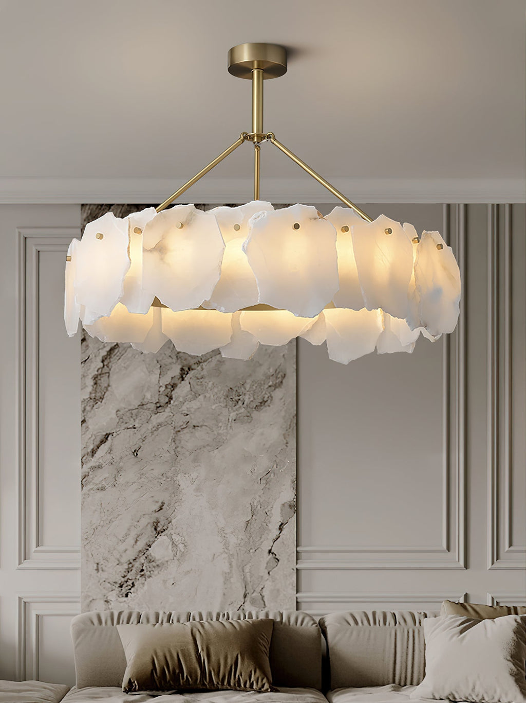 The Clérachic Cryon lit beside a stone-clad column, its layered alabaster shades echoing the veined marble.