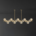 Longest bar of this Clérachic chandelier, its many crystal balls spread wide across a dark grey backdrop.