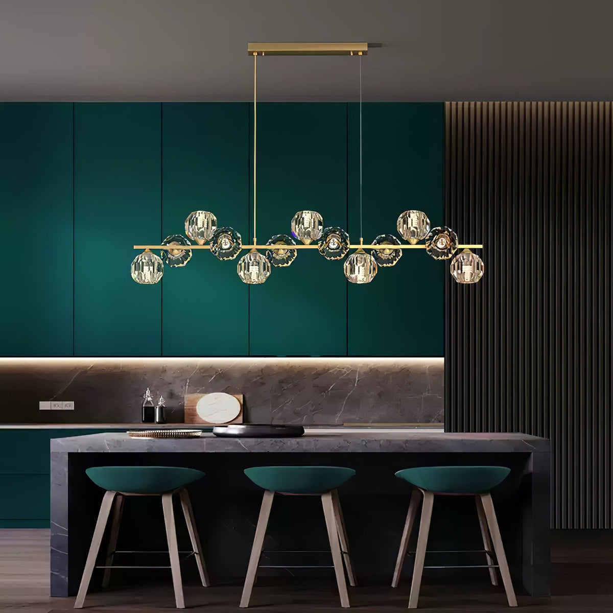 Rectangular canopy and two cords lower a Clérachic chandelier into a teal kitchen with three green bar stools below.