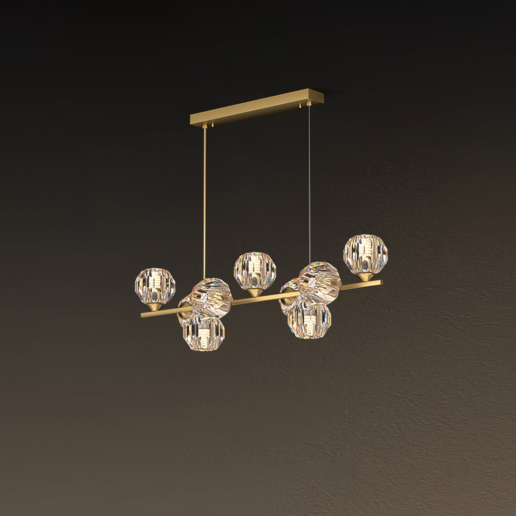 Angled view of the brass bar and its clear crystal balls on a rectangular canopy, a smaller Clérachic chandelier.