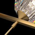 Close view of the brass cone and the woven cord below the bar, holding a crystal ball on this Clérachic chandelier.