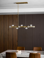 Clérachic chandelier on a rectangular canopy above a marble table, ribbed wood panelling on one side.
