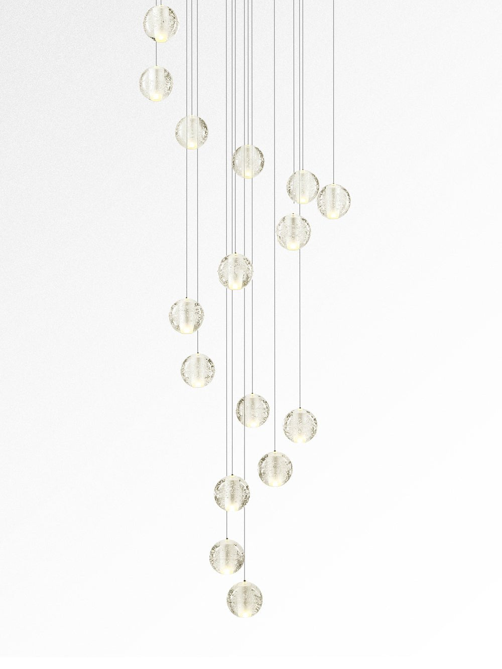 A narrow spiral of Clérachic crystal balls shown against white, glowing softly at different heights.