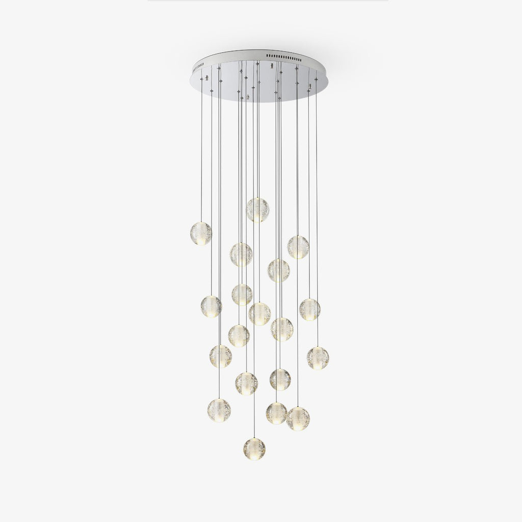 Clérachic crystal ball cluster hung from a round chrome ceiling plate, with the clear spheres at staggered heights, on white.