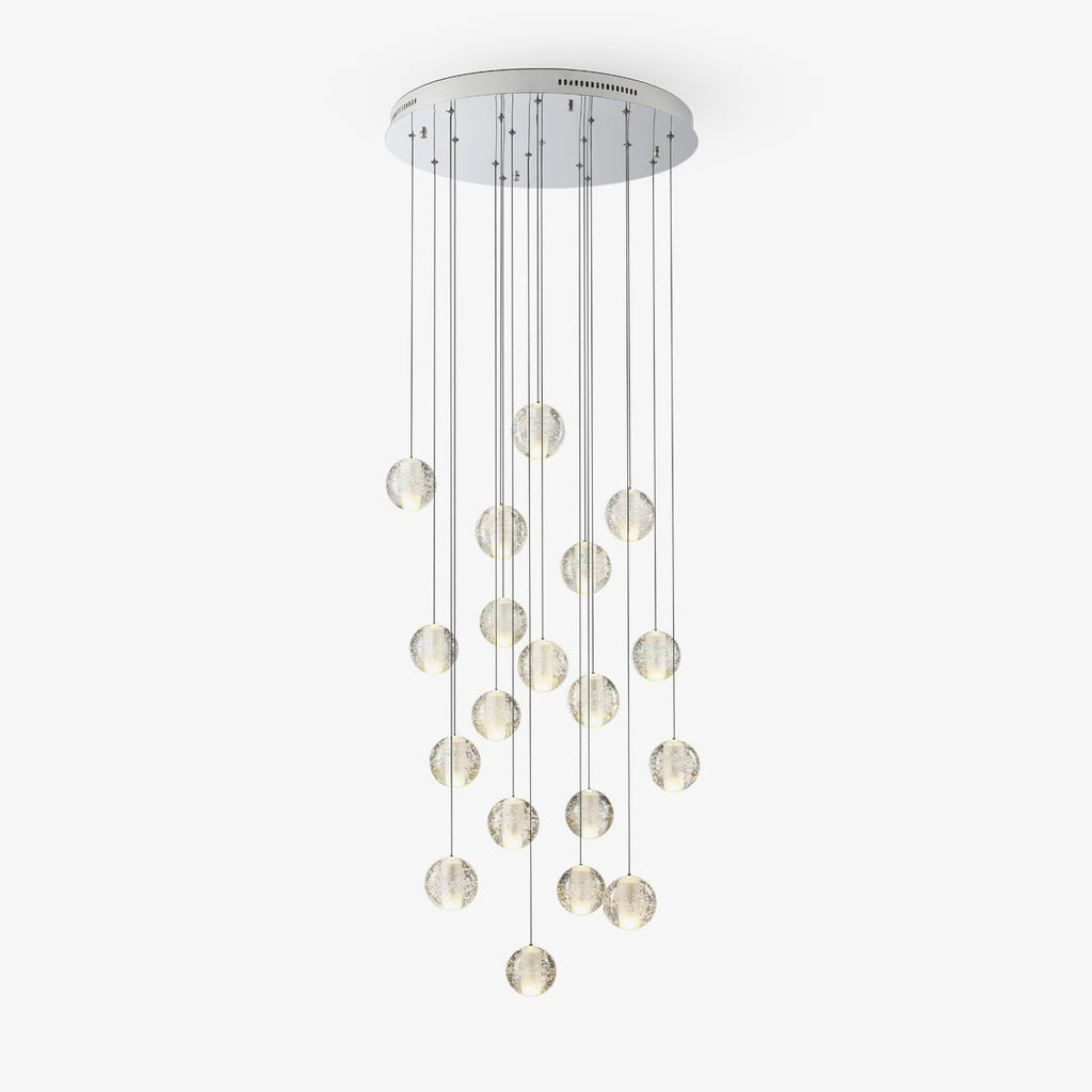 Clérachic crystal ball cluster on a round chrome ceiling plate with long thin cables, the spheres hanging at staggered heights on white.