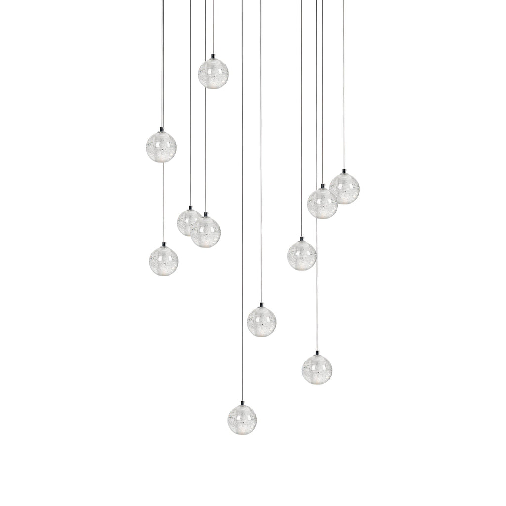 Clérachic crystal ball pendants in a wider spread, the clear spheres on cables of varied lengths, on white.