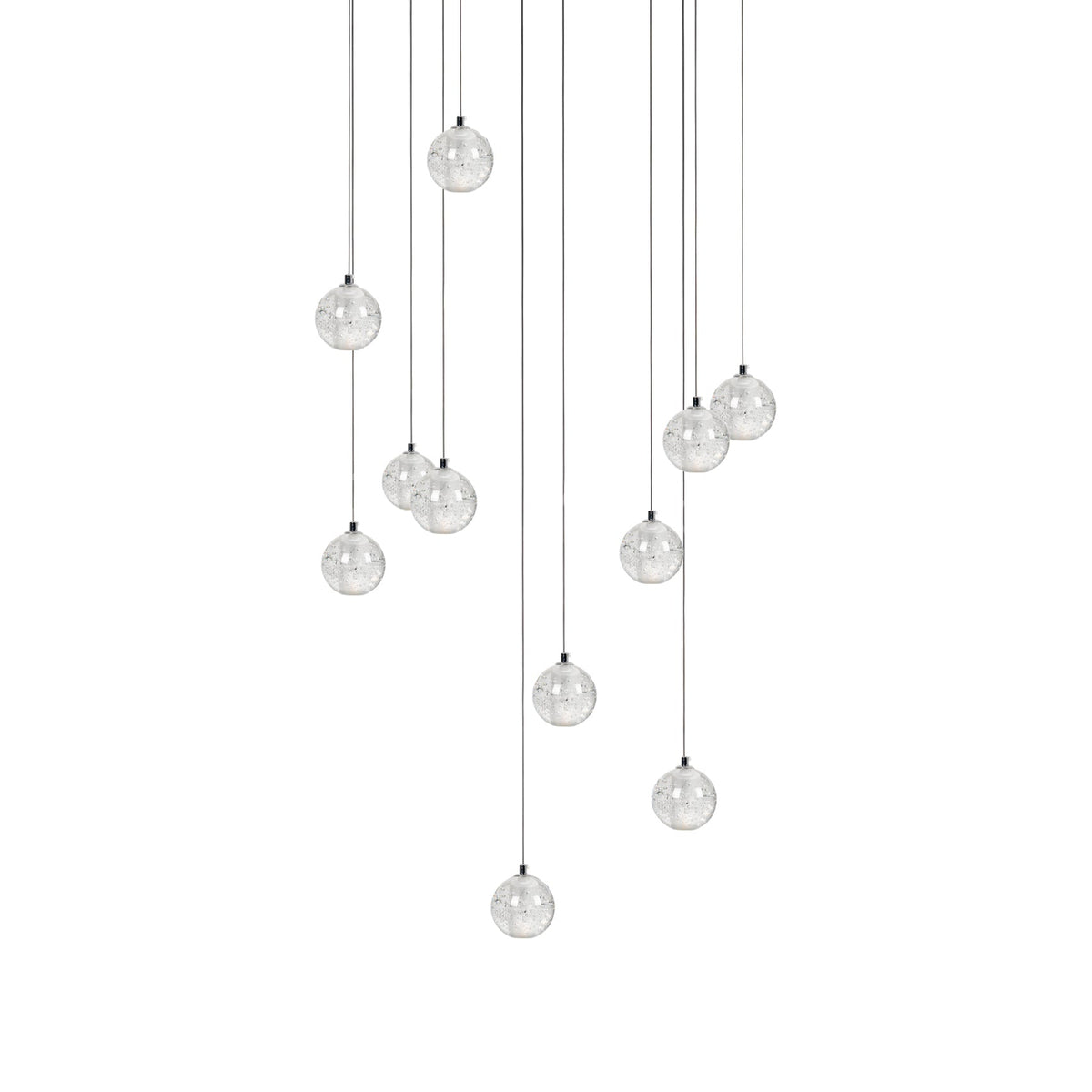 Clérachic crystal ball pendants in a wider spread, the clear spheres on cables of varied lengths, on white.