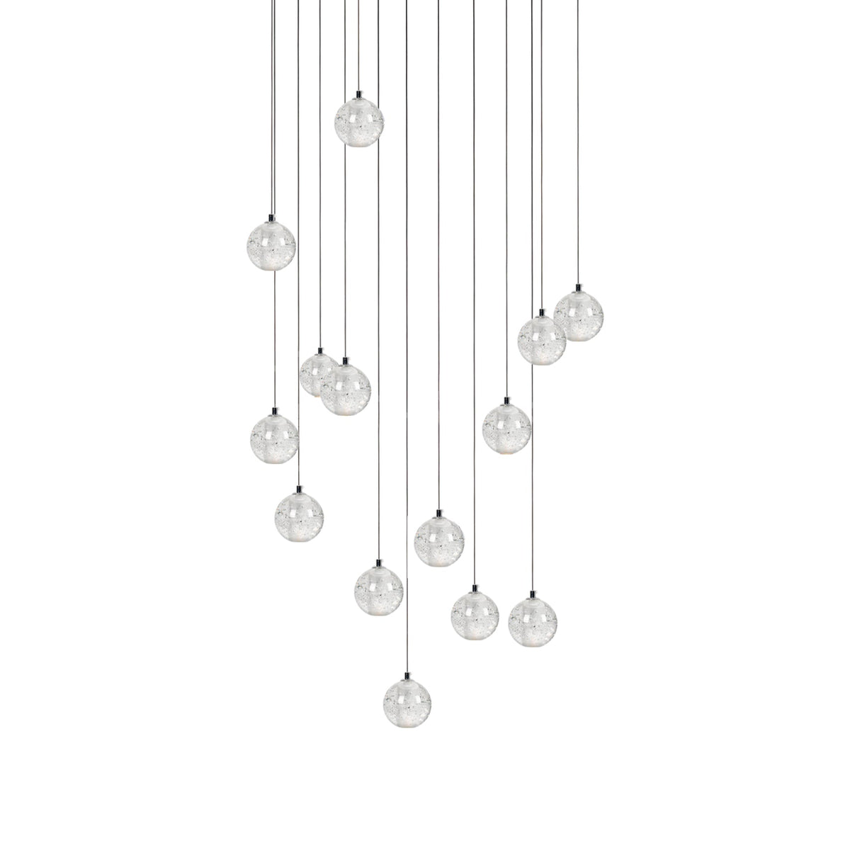 A fuller arrangement of Clérachic crystal ball pendants, with clear spheres on cables of many different lengths, on white.