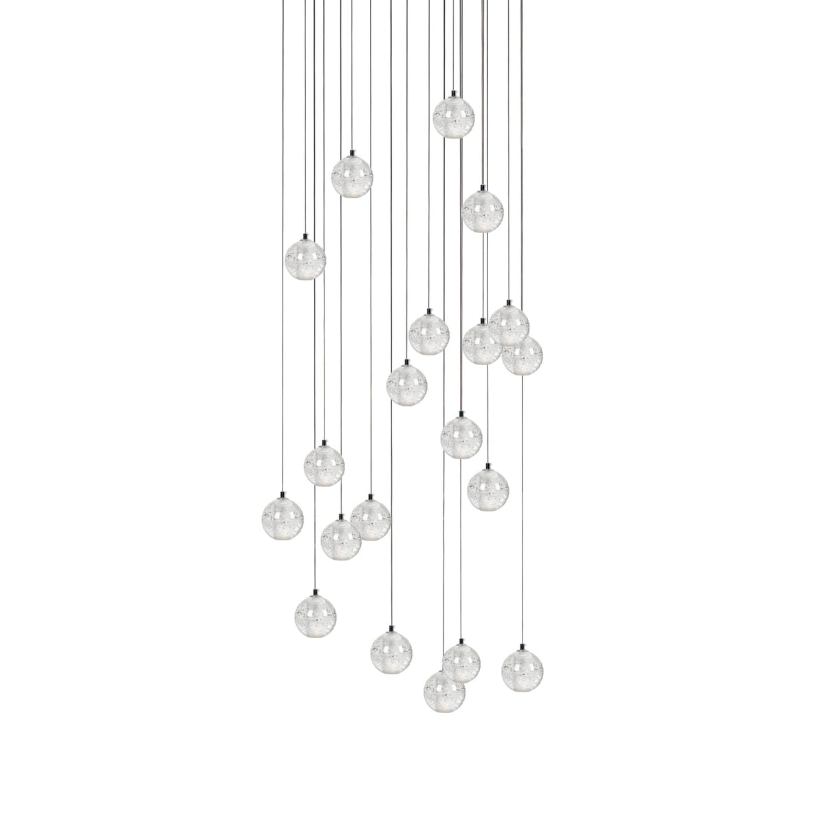 A long arrangement of Clérachic crystal ball pendants, the spheres spread over a deep drop on thin cables, on white.