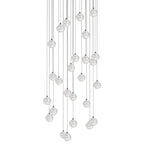 A tall, dense drop of Clérachic crystal ball pendants, with many clear spheres on cables of varied lengths, on white.
