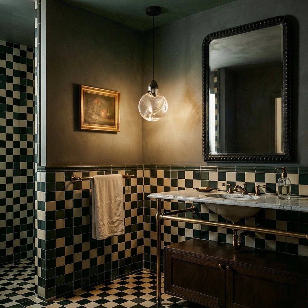 Clérachic round rippled glass pendant with a dark metal cap, hung in a tiled room with a marble washstand and mirror.