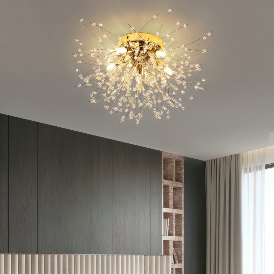 Clérachic gold crystal flush ceiling light on a pale ceiling beside grey wall panels, a shelf unit and soft curtains.