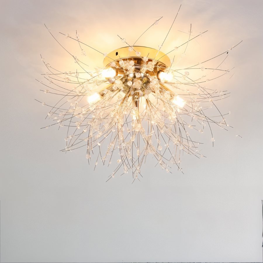 Clérachic gold crystal flush ceiling light seen close on a plain ceiling, bare bulbs lit among fine rods and clear beads.