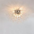 Clérachic silver crystal flush ceiling light on a pale ceiling, a wide spray of fine rods around bright bare bulbs.