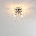 Clérachic four-head silver crystal flush ceiling light with a chrome canopy and sparse beaded rods, lit warm.