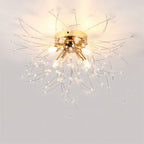Clérachic four-head gold crystal flush ceiling light with a round gold canopy and sparse beaded rods, lit warm.