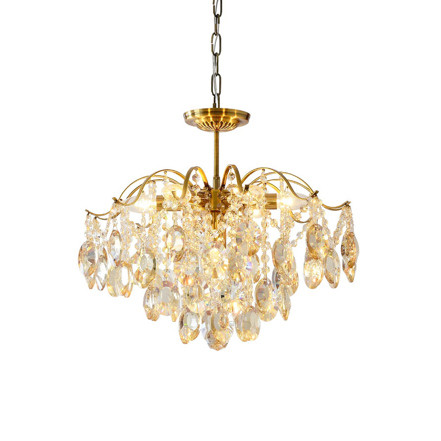 Chain-hung Clérachic chandelier with amber and clear crystals, photographed against a white backdrop with its brass canopy on show.