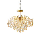 Chain-hung Clérachic chandelier with amber and clear crystals, photographed against a white backdrop with its brass canopy on show.